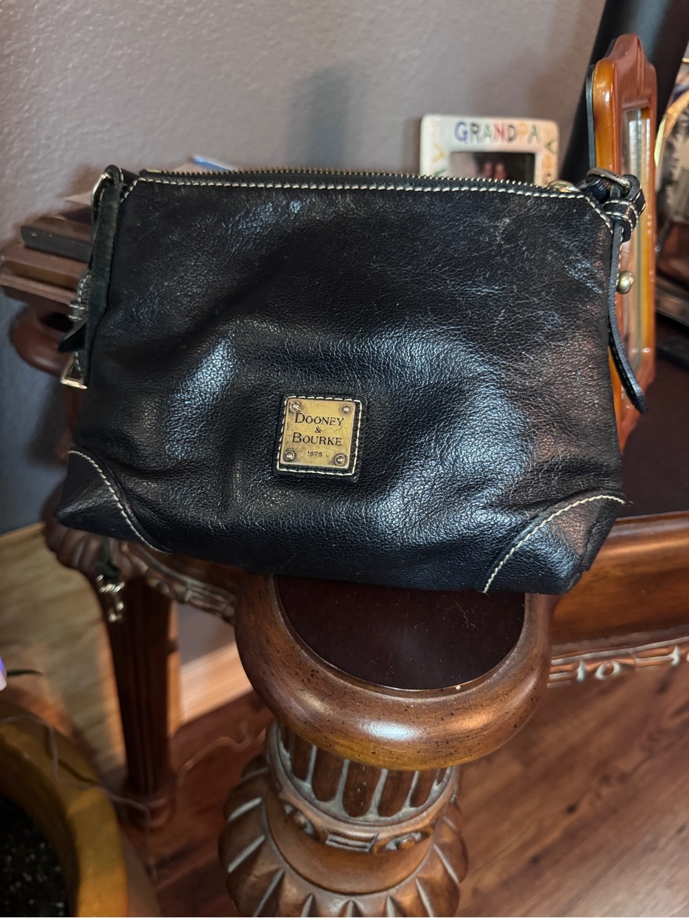 Dooney & Bourke Black Leather Toiletry Pouch with Brass Logo Plaque